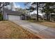 Exterior view of a well-maintained home with a spacious driveway in a suburban setting at 4938 Terrace Green Trce, Stone Mountain, GA 30088