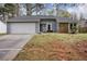 Charming home with a two-car garage, stone accents, and a well-maintained front lawn at 4938 Terrace Green Trce, Stone Mountain, GA 30088
