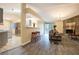 Open-concept living area featuring hardwood floors, a breakfast bar, and seamless transition to the kitchen at 4938 Terrace Green Trce, Stone Mountain, GA 30088