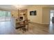 Bright living room with hardwood floors, a stone fireplace, and sliding doors for natural light at 4938 Terrace Green Trce, Stone Mountain, GA 30088