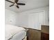 Bedroom featuring hardwood floors, a ceiling fan, and a large closet with bi-fold doors at 2120 Blaylock Dr, Marietta, GA 30062