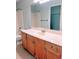 Well-lit bathroom with white quartz countertop and light wood cabinetry at 2657 Lenox Rd # F84, Atlanta, GA 30324