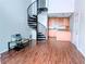 Living room area shows spiral staircase hardwood floors and eat-in kitchen at 2657 Lenox Rd # F84, Atlanta, GA 30324