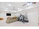 Finished basement featuring neutral carpet, ceiling fans, and exercise equipment at 332 William Dr, Canton, GA 30114