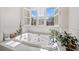 Soaking tub featuring a large window and tile surround, creating a relaxing and bright space for unwinding at 332 William Dr, Canton, GA 30114