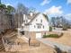 Rear exterior view of a two-story home with stone foundation and walk-out basement and deck at 332 William Dr, Canton, GA 30114