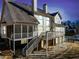 Exterior view of a large house with a deck, stone accents, and manicured lawn at 332 William Dr, Canton, GA 30114