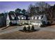 Wide angle shot of gorgeous home with 3-car garage and covered front porch at 332 William Dr, Canton, GA 30114