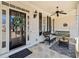 Inviting front porch with a ceiling fan, welcome sign, and stylish seating arrangement at 332 William Dr, Canton, GA 30114