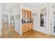 Elegant bar area with natural wood cabinets and granite countertops, perfect for entertaining guests at 332 William Falls Dr, Canton, GA 30114