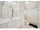 Bright bathroom with white vanity, tiled floor, and shower-tub combination at 332 William Falls Dr, Canton, GA 30114