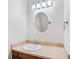 Bathroom featuring a vanity with a granite countertop, wood cabinetry, and modern lighting at 332 William Falls Dr, Canton, GA 30114