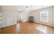 Bright bedroom featuring hardwood floors, a ceiling fan, and a window with blinds, great for relaxation at 332 William Falls Dr, Canton, GA 30114