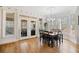 Dining area with hardwood floors, large bay window, and access to the outdoor patio at 332 William Falls Dr, Canton, GA 30114