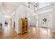 Bright foyer showcasing hardwood floors, high ceilings, and an elegant chandelier at 332 William Falls Dr, Canton, GA 30114