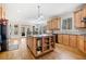 Expansive kitchen featuring a central island, natural wood cabinets, and views to the outside at 332 William Falls Dr, Canton, GA 30114