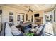 Screened porch with coffered ceiling, stone fireplace and seating area at 332 William Falls Dr, Canton, GA 30114