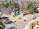 An aerial view of a beautifully landscaped home on a corner lot surrounded by trees at 332 Williamfalls Dr, Canton, GA 30114