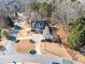 An aerial view of a corner lot home with a circular driveway and mature trees at 332 Williamfalls Dr, Canton, GA 30114