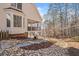Home exterior with covered porch, stone detail, and wooded view at 332 Williamfalls Dr, Canton, GA 30114