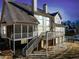 Exterior of the home with multilevel porches and lush back yard at 332 Williamfalls Dr, Canton, GA 30114