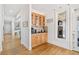 Inviting bar area with wood cabinets, granite countertops, and views of the stone fireplace and outdoor scenery at 332 Williamfalls Dr, Canton, GA 30114
