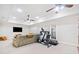 Spacious basement featuring a comfortable seating area and exercise equipment at 332 Williamfalls Dr, Canton, GA 30114