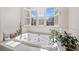 Bathroom showcasing a soaking tub beneath a window with plantation shutters at 332 Williamfalls Dr, Canton, GA 30114