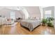 A stylish bedroom with a sloped ceiling, a fan, and a sitting area at 332 Williamfalls Dr, Canton, GA 30114