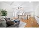 Large bonus room with high ceilings, hardwood floors, and cozy seating, perfect for relaxing at 332 Williamfalls Dr, Canton, GA 30114