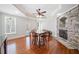 Inviting dining area with stone fireplace, hardwood floors and trey ceilings at 332 Williamfalls Dr, Canton, GA 30114