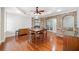 Open dining room with stone accents, fireplace, hardwood floors, and trey ceilings at 332 Williamfalls Dr, Canton, GA 30114