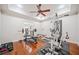 Well-lit exercise room with hardwood floors, ceiling fan, and fitness equipment at 332 Williamfalls Dr, Canton, GA 30114
