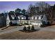 Beautiful home with mature trees and a well-manicured lawn during dusk at 332 Williamfalls Dr, Canton, GA 30114