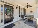 Inviting front porch with stylish decor, including a ceiling fan and comfortable seating at 332 Williamfalls Dr, Canton, GA 30114