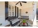 Charming front porch with a swing, ceiling fan, and cozy seating area at 332 Williamfalls Dr, Canton, GA 30114