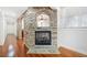 Hallway with stone fireplace and archways showcasing the home's architectural detail at 332 Williamfalls Dr, Canton, GA 30114