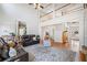 Open-concept living room with hardwood floors, high ceilings, and seamless flow at 332 Williamfalls Dr, Canton, GA 30114