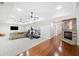 Open living room with hardwood floors, fireplace, and ceiling fans at 332 Williamfalls Dr, Canton, GA 30114