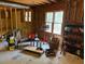 Unfinished basement with exposed framing, tools, lighting and workbench at 4508 Bankside Court, Marietta, GA 30066