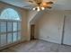 Bedroom features large arched window and ceiling fan at 4508 Bankside Court, Marietta, GA 30066