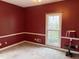 Red bedroom featuring a single window letting in plenty of natural light at 4508 Bankside Court, Marietta, GA 30066