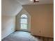 Cozy bedroom featuring a pitched roof, a window and soft carpet flooring at 4508 Bankside Court, Marietta, GA 30066