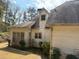 Side view of home with dark shingle roof, light siding, and small bushes at 4508 Bankside Court, Marietta, GA 30066