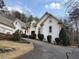 Charming home with white stucco, arched windows, and a well-manicured front yard at 4508 Bankside Court, Marietta, GA 30066