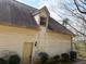 Side exterior view of home with light siding, dark roof, and green landscaping at 4508 Bankside Court, Marietta, GA 30066