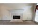 A cozy fireplace with a marble surround, perfect for relaxation and warmth at 4508 Bankside Court, Marietta, GA 30066