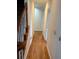 Hallway with hardwood floors, leading to various rooms in the home at 4508 Bankside Court, Marietta, GA 30066