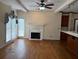 Inviting living room with beamed ceiling, fireplace, wood floors, and sliding glass doors at 4508 Bankside Court, Marietta, GA 30066