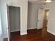 Bedroom featuring hardwood floors, a ceiling fan, and multiple doors leading to other areas at 684 S Hairston Rd, Stone Mountain, GA 30088